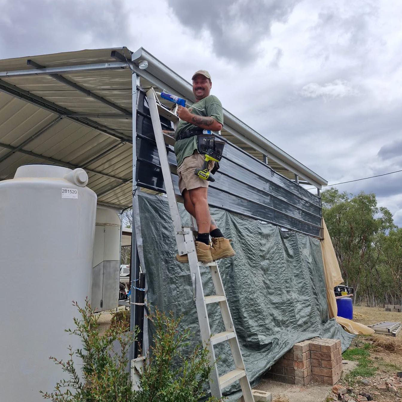 Reece, owner of RB Home Repairs, working on an exterior at a property near Inverell.